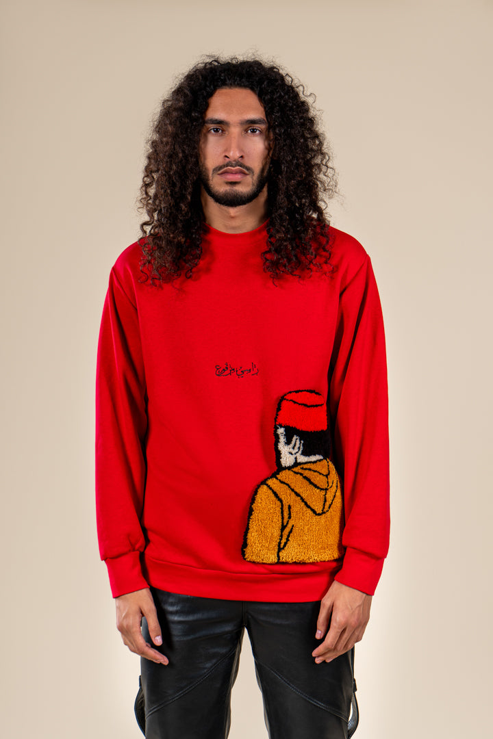 Pull Tarbouche Numidie rouge avec motif tufting artisanal, porté par un homme.