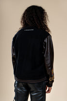 Vue arrière du Varsity Jacket Tamurt Numidie en laine et cuir noir.