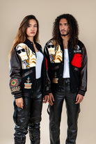 Duo homme et femme portant le Varsity Jacket Tamurt Numidie en laine et cuir noir.